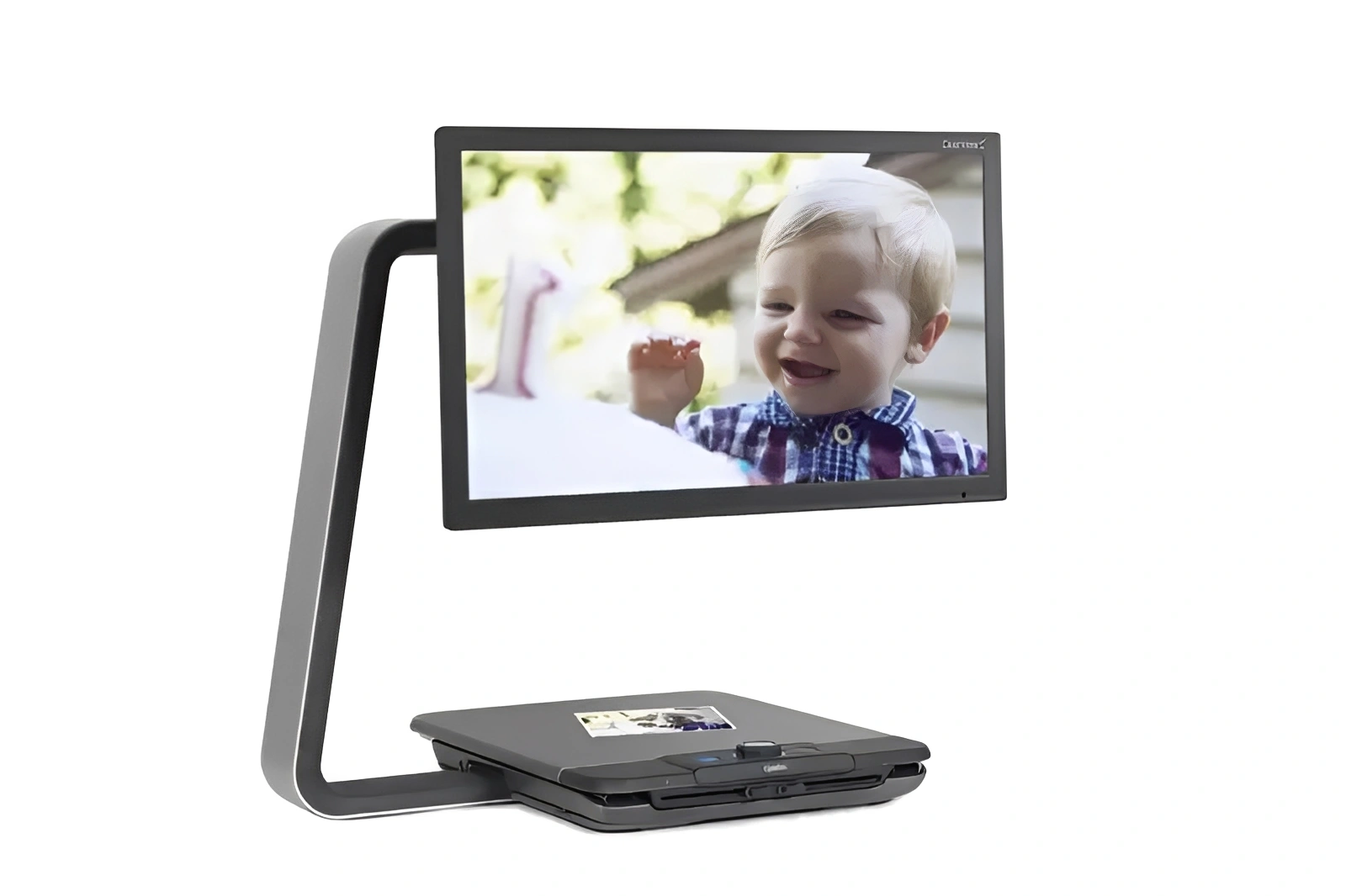 Baby on screen of modern video magnifier.