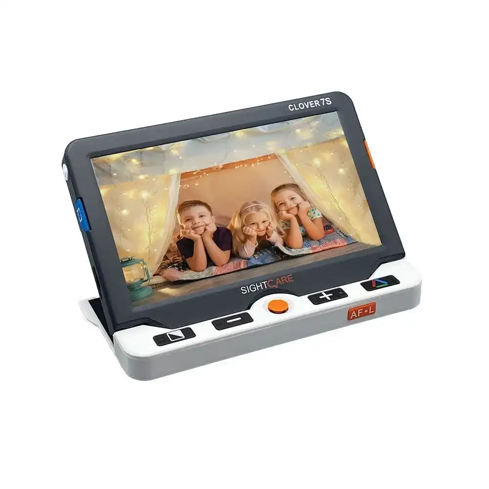 Electronic magnifier displaying children under blanket.